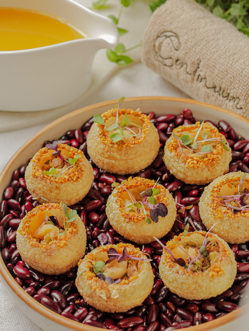 Golgappas with passion fruit and jalapeño water at Continuum