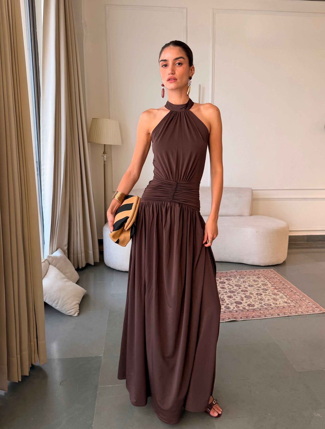 Model wearing Evierose’s chocolate-brown Ellie halter maxi dress