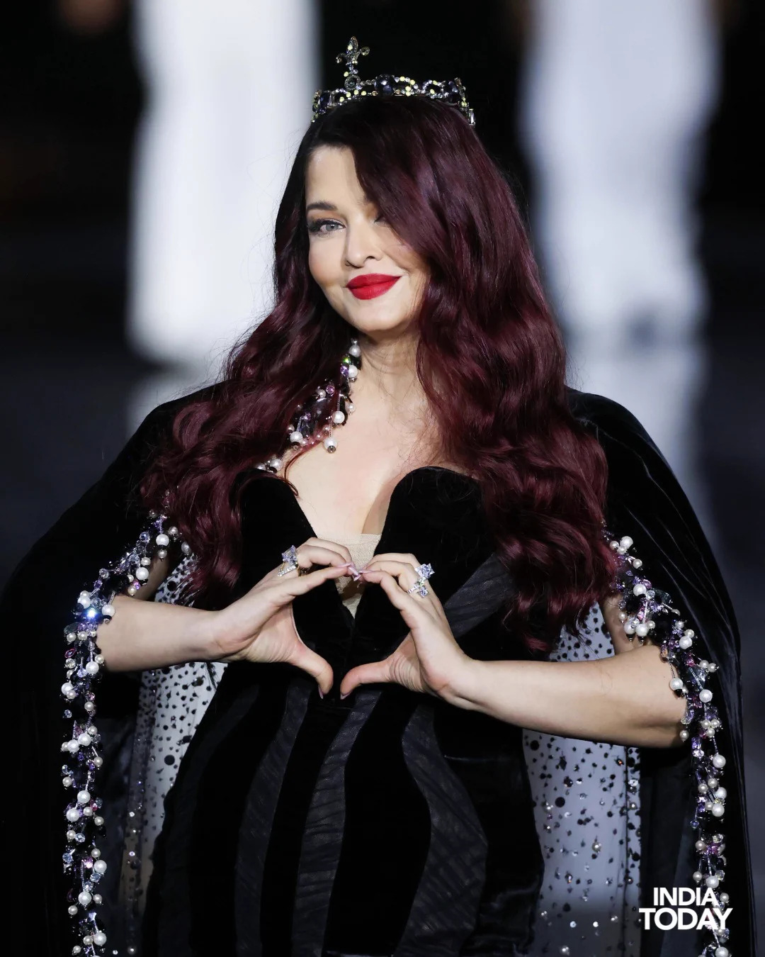 Aishwarya Rai in a black velvet Yara Shoemaker ensemble at Le Défilé L’Oréal Paris in September 2026.