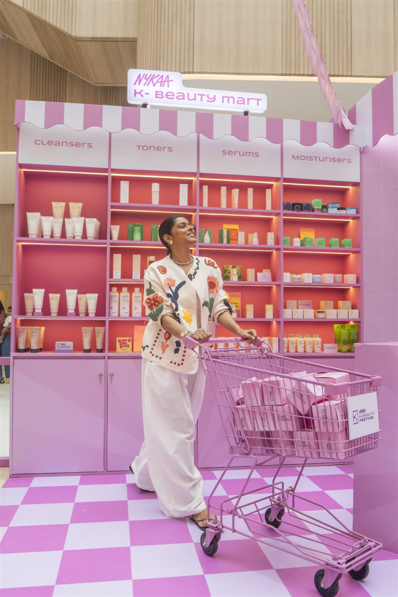 Visitor with a pink shopping trolley at Nykaa’s K-Beauty Mart