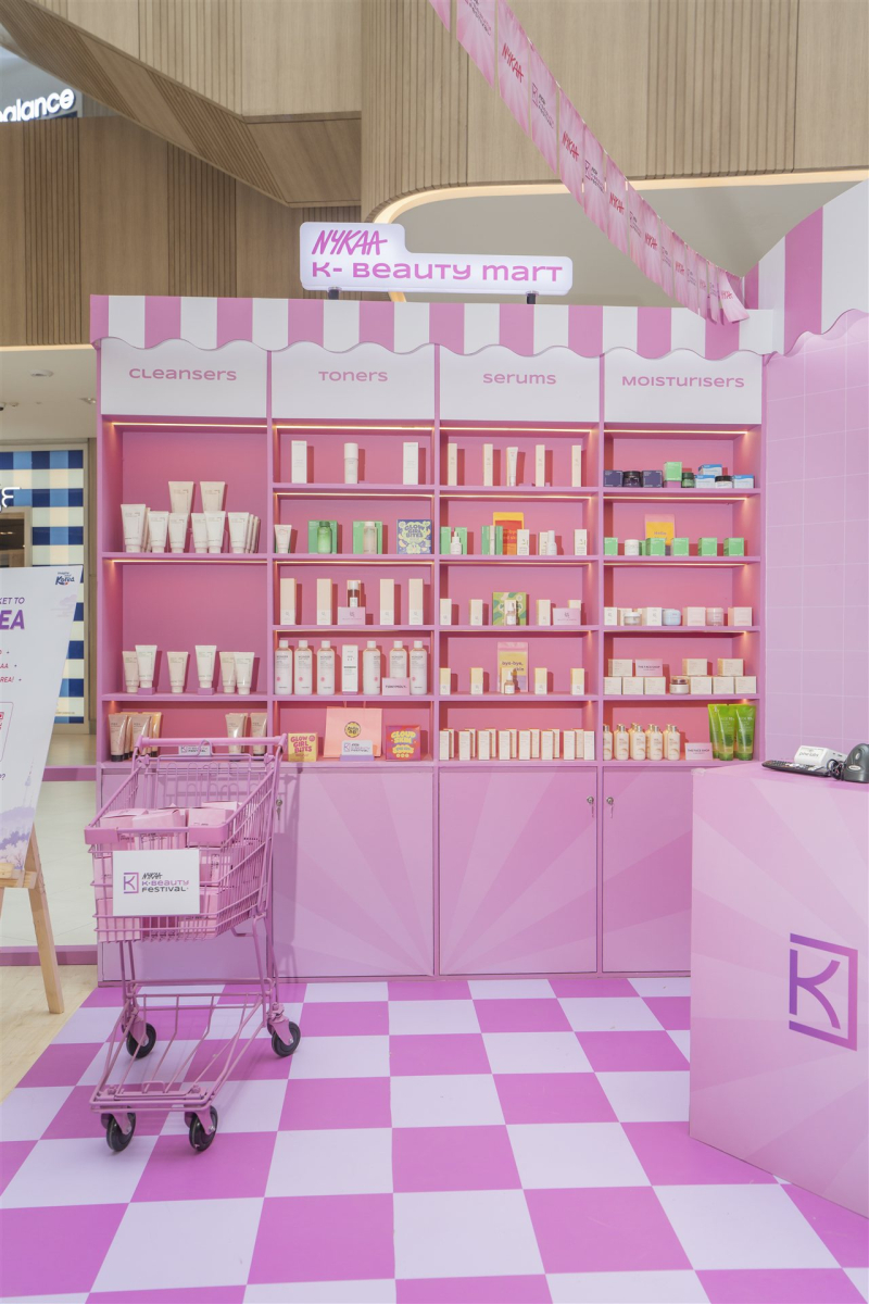 Pink Nykaa K-Beauty Mart shelves displaying Korean skincare products