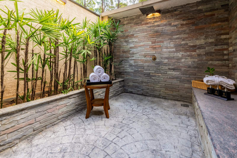 Open-sky outdoor shower at Rosetta Sakleshpur