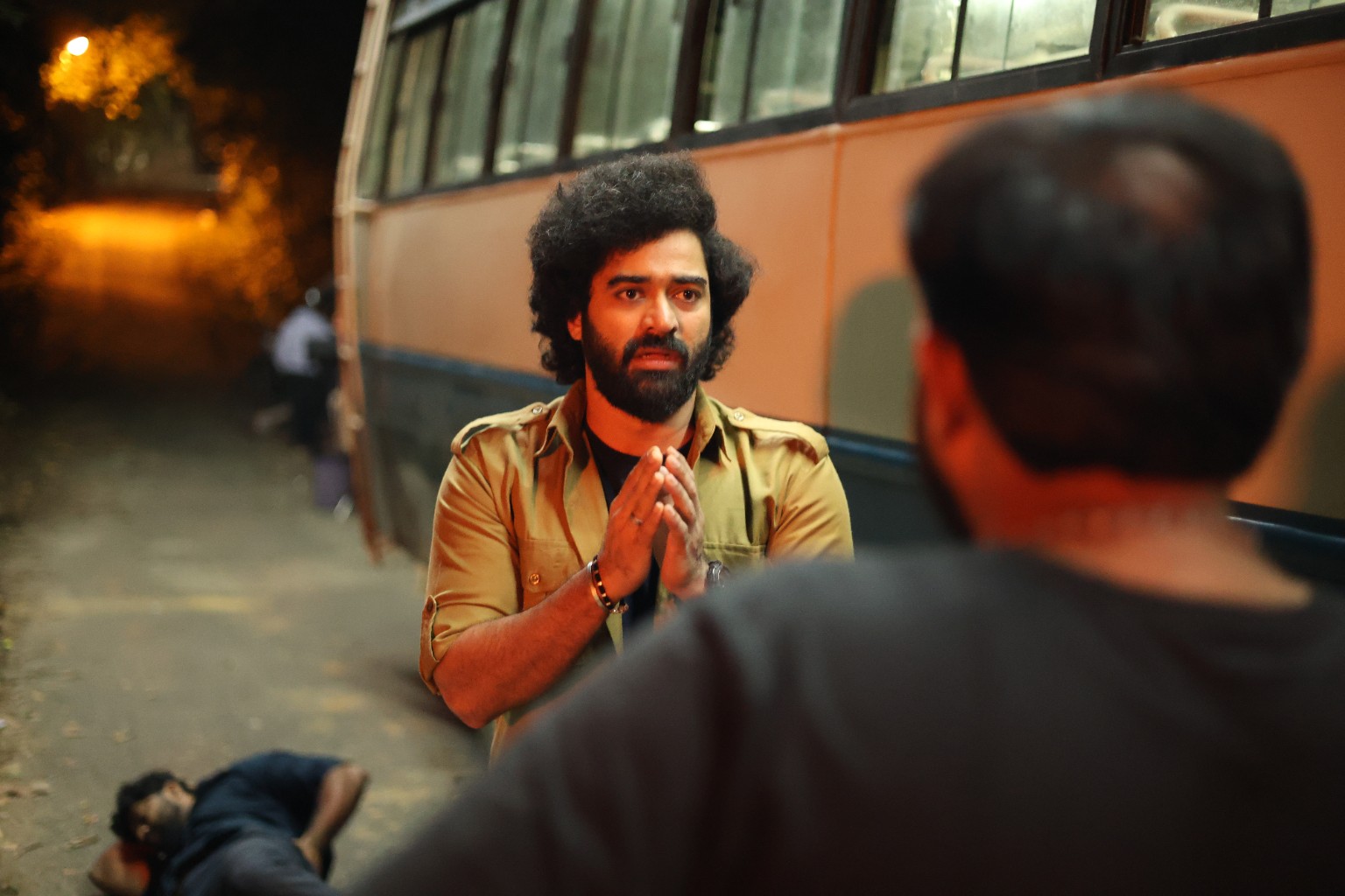 Shine Shetty in a scene from Shankarabharana beside a private bus