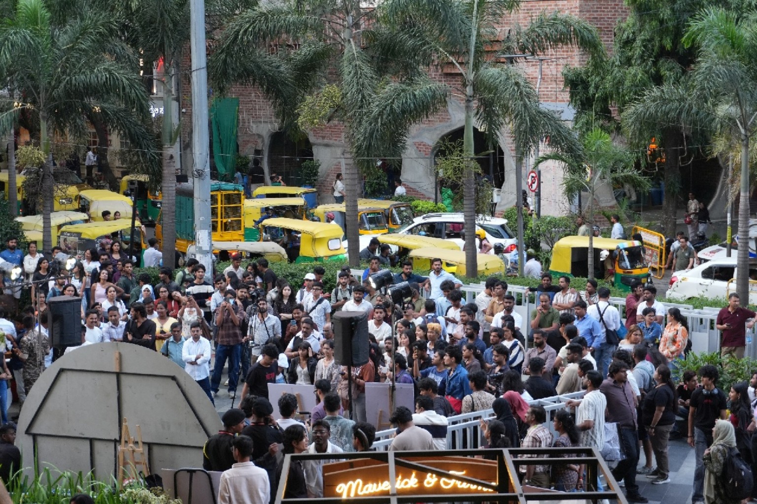 A crowd gathered around an earlier public busking performance