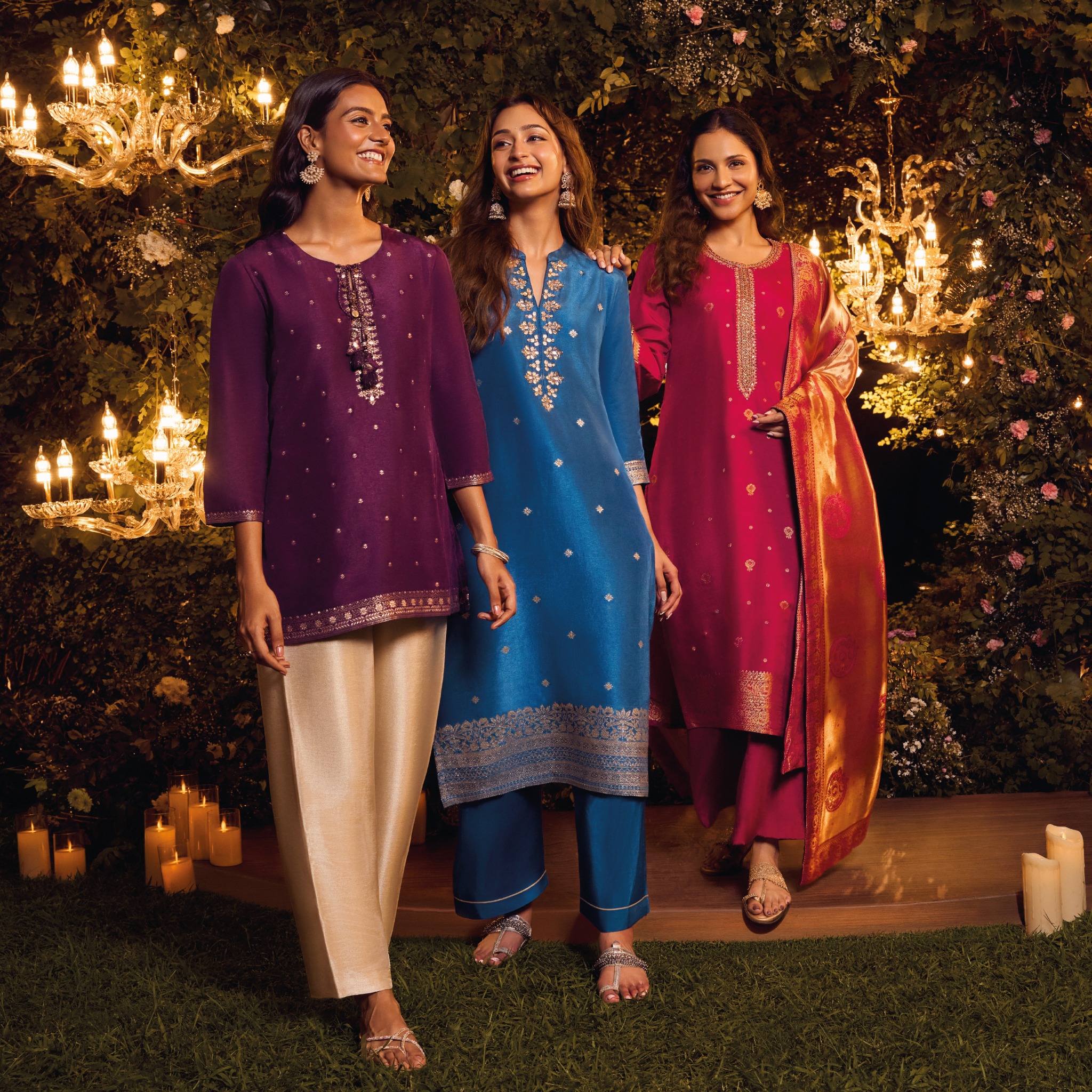 Models in purple, blue and magenta festive kurta sets with gold detailing