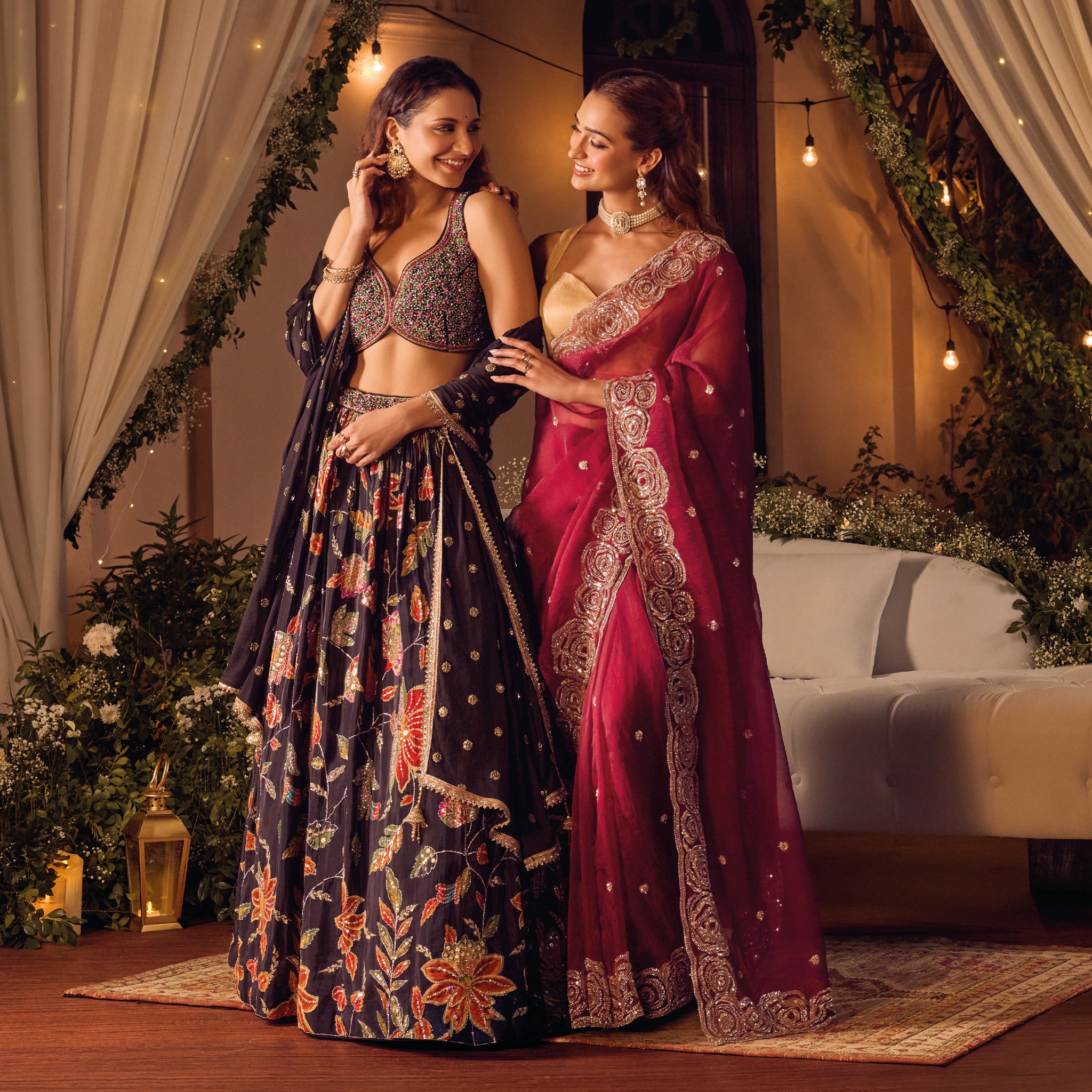 Models wearing an embroidered floral lehenga and red saree from Soch Festive 2026