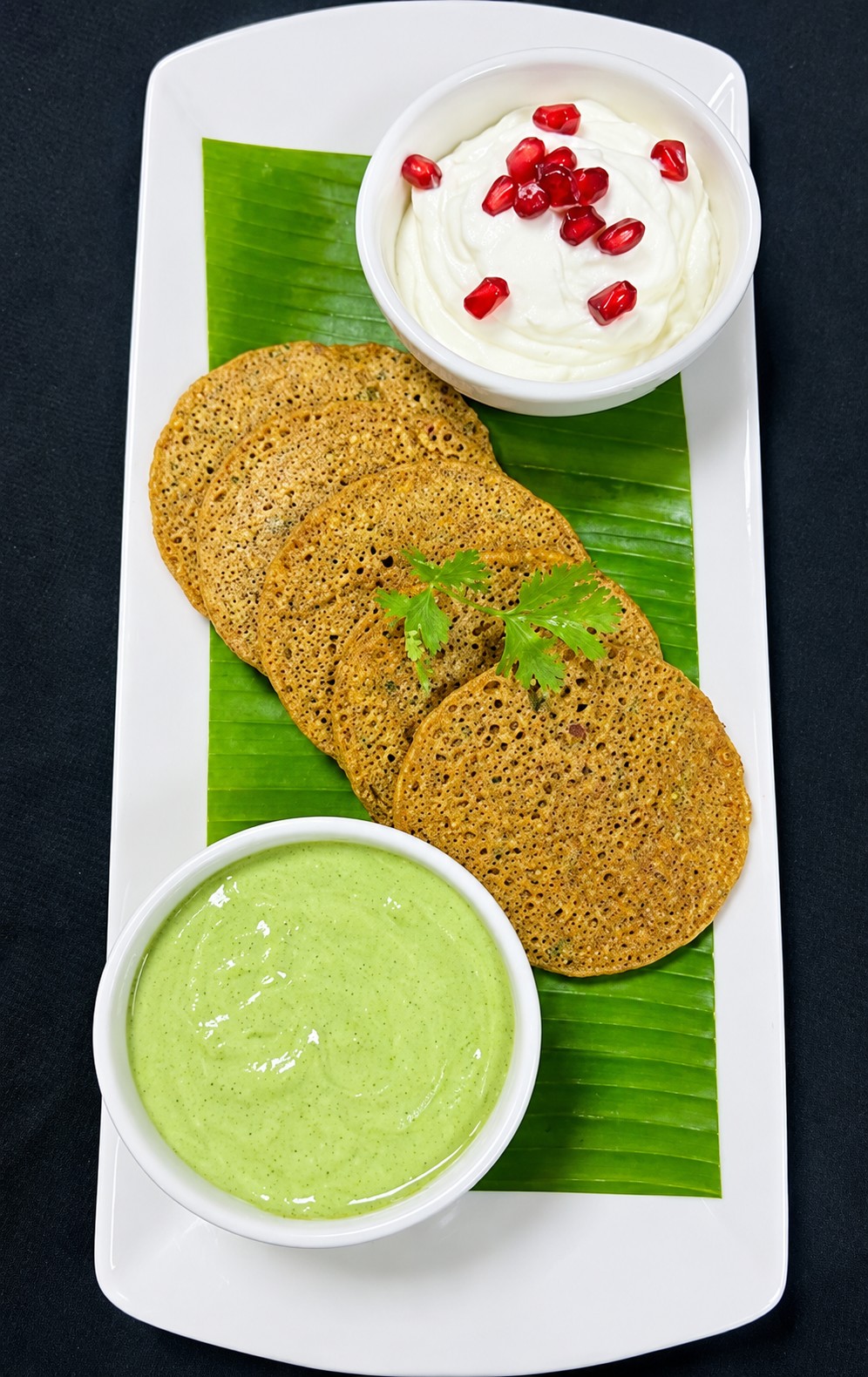 Amaranth and potato pancakes with curd and chutney