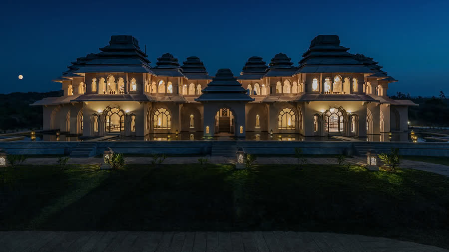 Illuminated palace-inspired façade of Evolve Back Hampi